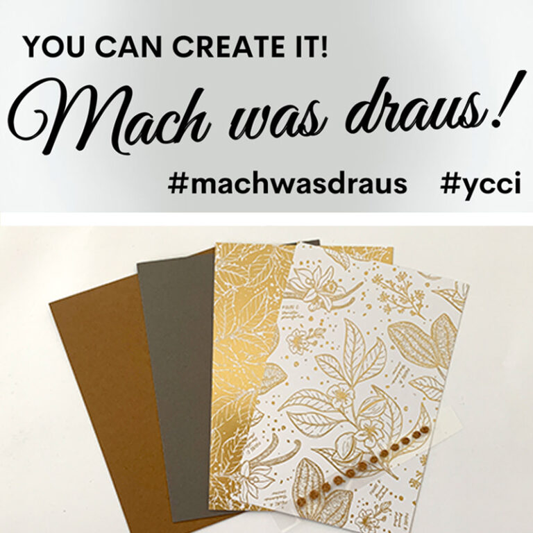 Bastelmaterialien wie gemustertes Papier und Karton mit dem motivierenden Slogan „You can create it! Mach was draus!“ in Englisch und Deutsch.