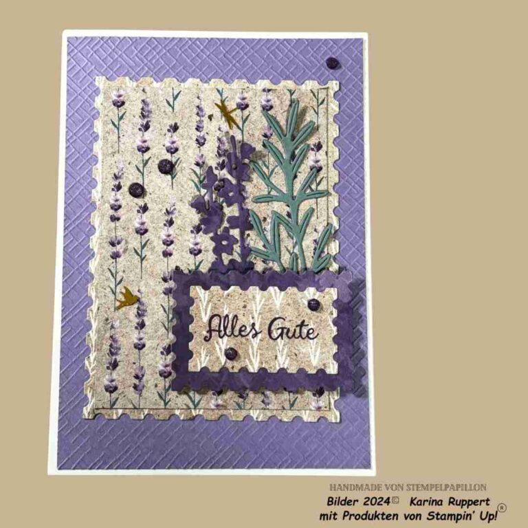 Handgefertigte Grußkarte mit Lavendel- und Grünpflanzenmotiven, dem Text „Mach was draus“ und Ziernähten auf violettem, gewelltem Hintergrund.