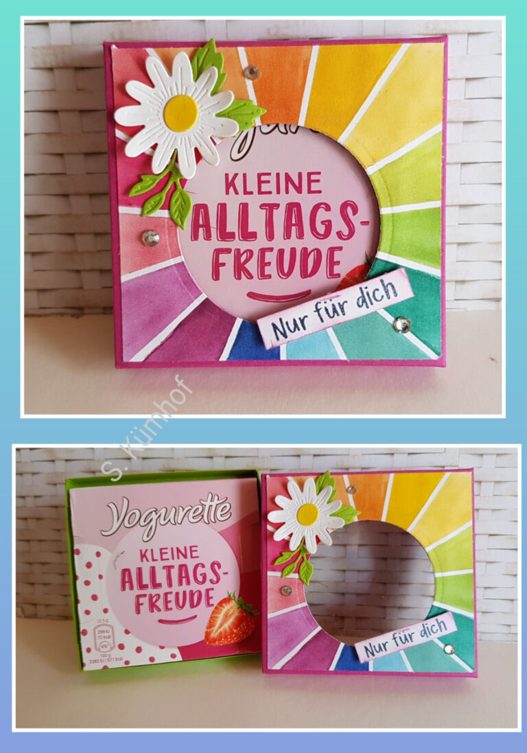 Eine bunte Geschenkschachtel mit einem Gänseblümchen und dem Text „Nur für dich“ darauf. Daneben eine weitere Schachtel mit der Aufschrift „Yogurette“, die Schokolade mit Erdbeergeschmack enthält. Ein perfekter Leckerbissen, den man am 24. August genießen kann und der einen an „Mach was draus“ erinnert.