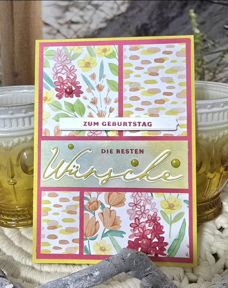 Eine deutsche Geburtstagskarte mit floralen Motiven und den Sätzen "Zum Geburtstag" und "Die besten Wünsche" auf der Vorderseite, neben zwei gelben Glas-Kerzenhalter, perfekt für Ihre Mach was draus 25 Juni Feier.