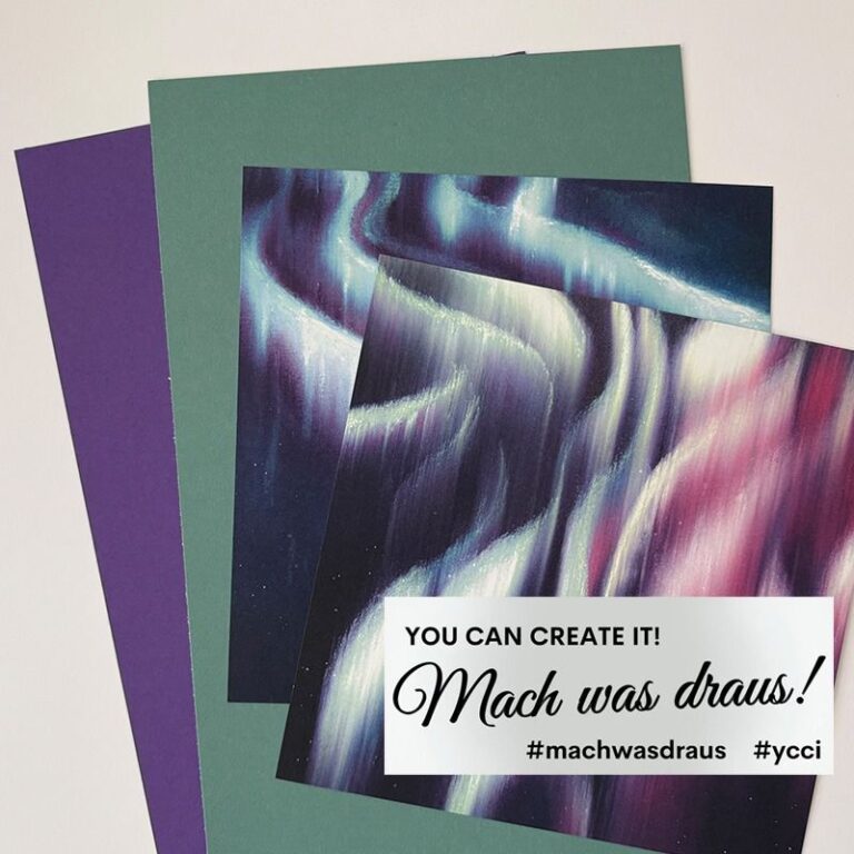 Zwei Stücke Kunstdruckpapier, ein grünes und ein violettes, mit einem Gemälde aus abstrakten pastellfarbenen Lichtstreifen auf der Oberseite; Textüberlagerung: "Du kannst es schaffen! Mach was draus 25. Oktober!" mit Hashtags.