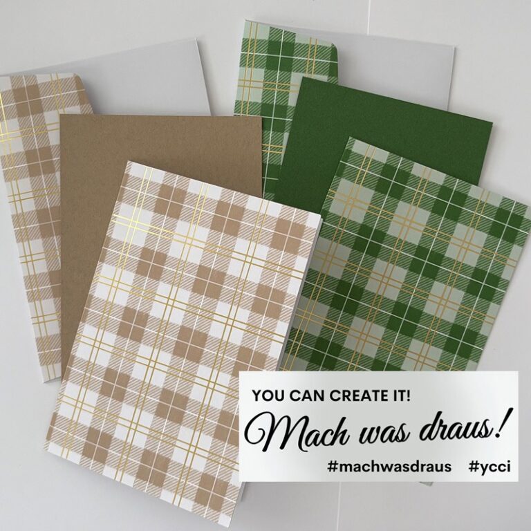 Fünf Blätter kariertes Papier in Beige- und Grüntönen sowie zwei einfarbige Blätter sind auf einer weißen Fläche angeordnet. In der Ecke steht ein Etikett mit der Aufschrift "Du kannst es schaffen! Mach was draus 25. Dezember.