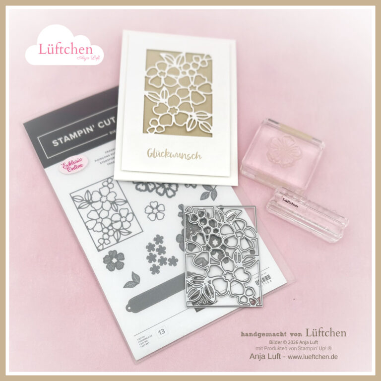 Eine florale Metallstanze, Klarsicht-Stempelblöcke und eine gestempelte Grußkarte werden auf einer rosafarbenen Fläche mit Lüftchen und Stampin' Up!-Schriftzug präsentiert, die Exklusiv Online am 26. Januar präsentiert.