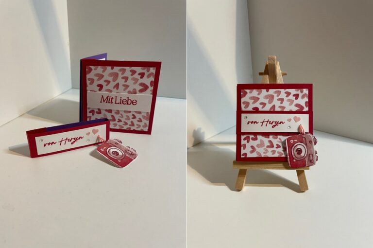 Zwei handgefertigte Grußkarten mit roten Herzmustern und deutschem Text, eine davon auf einer kleinen hölzernen Staffelei, neben kleinen, roten kameraförmigen Ausschnitten - perfekt für Ihr Mach was draus 26. Januar-Kreativprojekt.