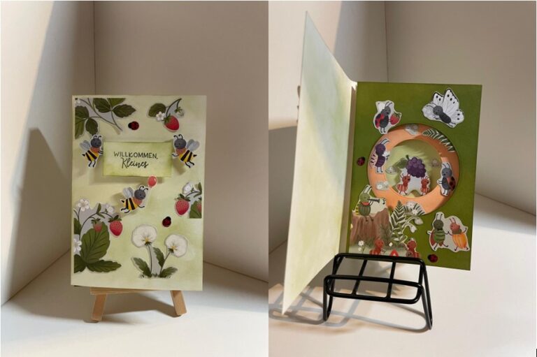 Eine handgefertigte Grußkarte mit Bienen- und Erdbeerillustrationen auf dem Umschlag, inspiriert von "Mach was draus Februar 26", mit Tieraufklebern um eine Weintraube auf grünem Hintergrund im Inneren.